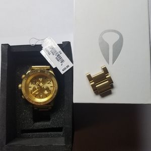 Woman's gold Nixon watch